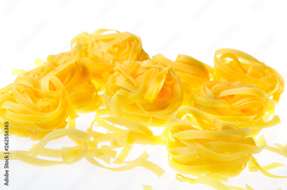 Yellow pasta on a white background. Close-up Yellow pasta on a white background. Close-up