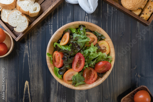 flat lay vegetable salad on bowl and bread