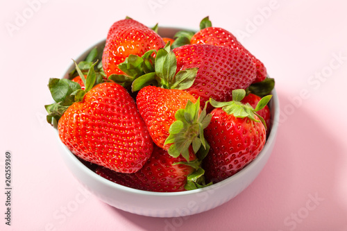 Fresh strawberries in ceramic bowl