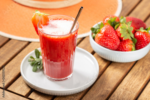 Sweet fresh strawberry smoothie. Leisure scene