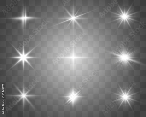 A set of bright beautiful stars. Light effect. Bright Star. Beautiful light for illustration. Christmas star.White sparkles shine special light effect. Vector sparkles on a transparent background.