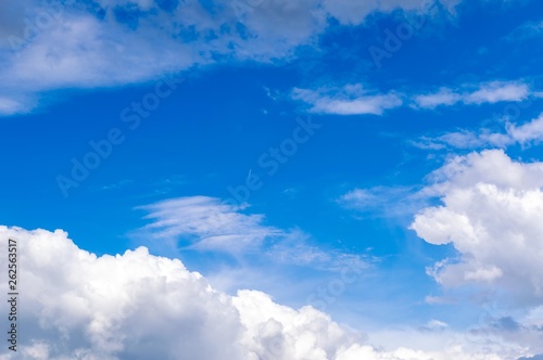 light white clouds against a blue sky