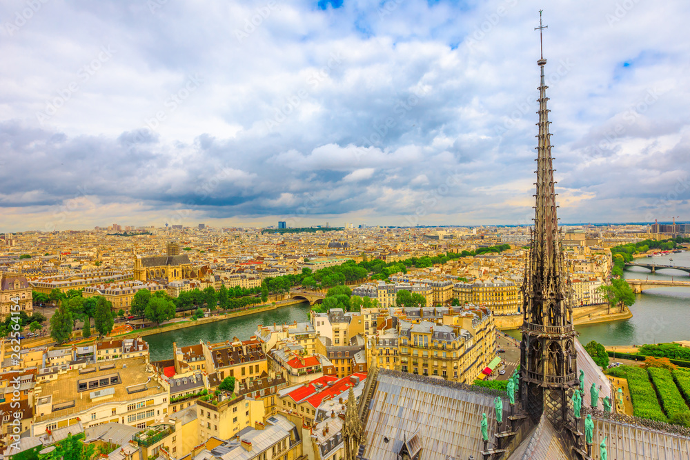 The spire of Notre Dame cathedral collapsed in April 2019. Paris city capital of France. Top view of the gothic church Our Lady of Paris, aerial view on Paris skyline.