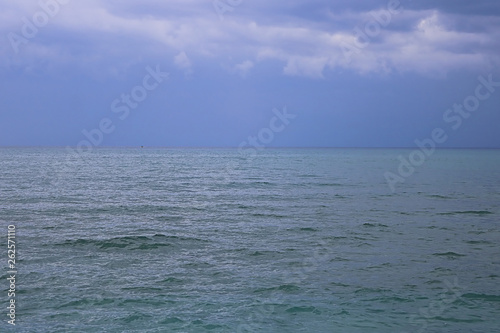 View of Mediterranean Sea with a cloudy blue sky after the rain. Waves and wind in Larnaca beach