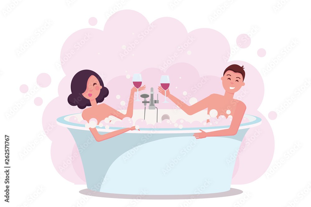 Couple in bath enjoying drinking red wine. Young man and woman