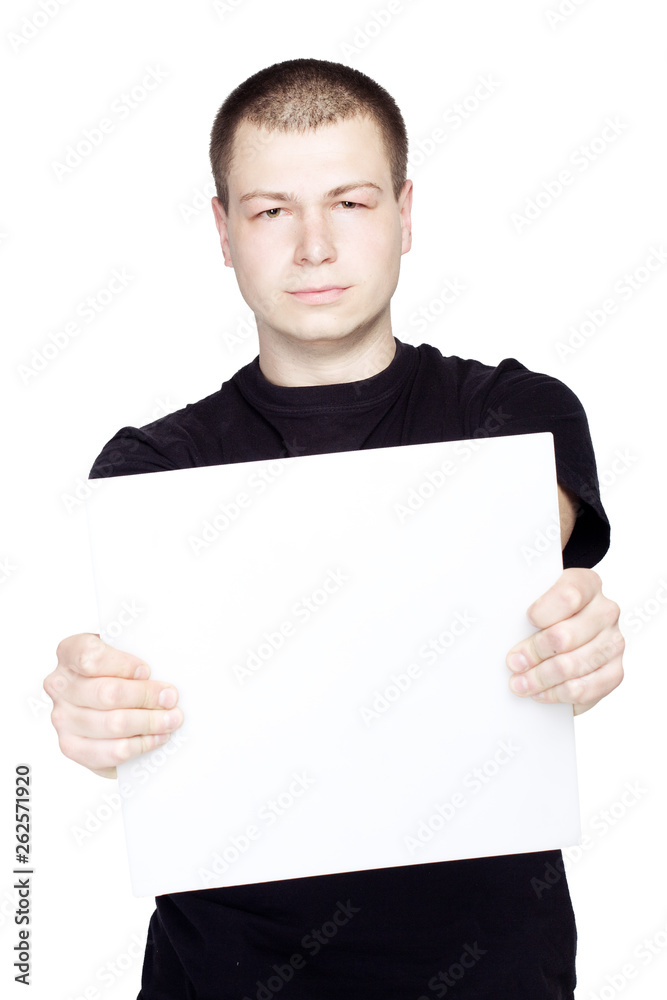 Young man holding a blank sheet empty on white background isolated Young man holding a blank sheet empty on white background isolated