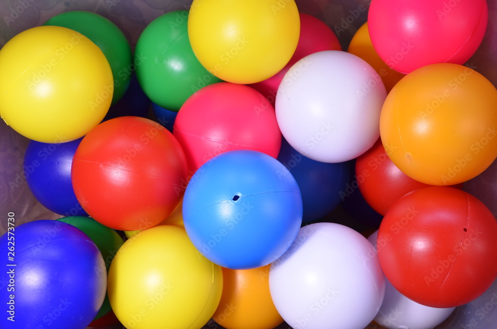 Plastic colored children's balls. Bright round balls for children's pools and games Plastic colored children's balls. Bright round balls for children's pools and games