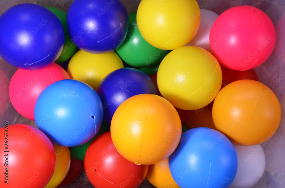 Plastic colored children's balls. Bright round balls for children's pools and games Plastic colored children's balls. Bright round balls for children's pools and games