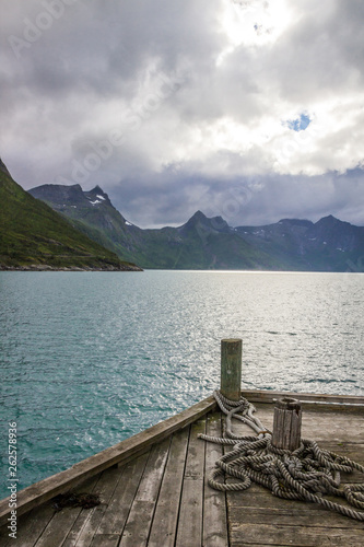 clouds over the fjord on Senja island in Norway