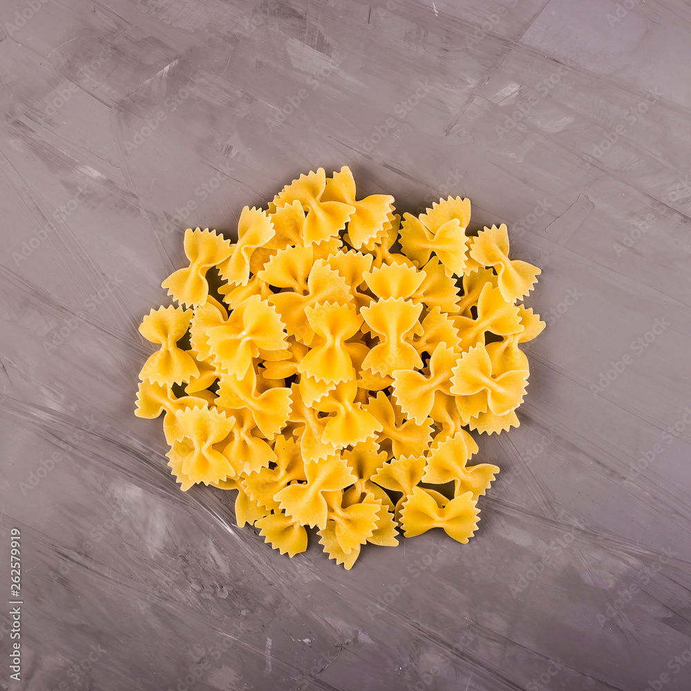 Simple homemade pasta cooking farfalle and dish ingredients - obrazy, fototapety, plakaty 
