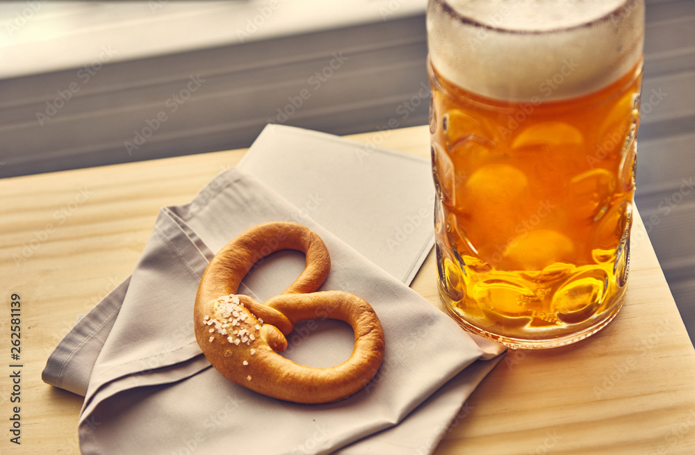 Sausages with potatoes and Pretzels Bavarian with a beer Sausages with potatoes and Pretzels Bavarian with a beer