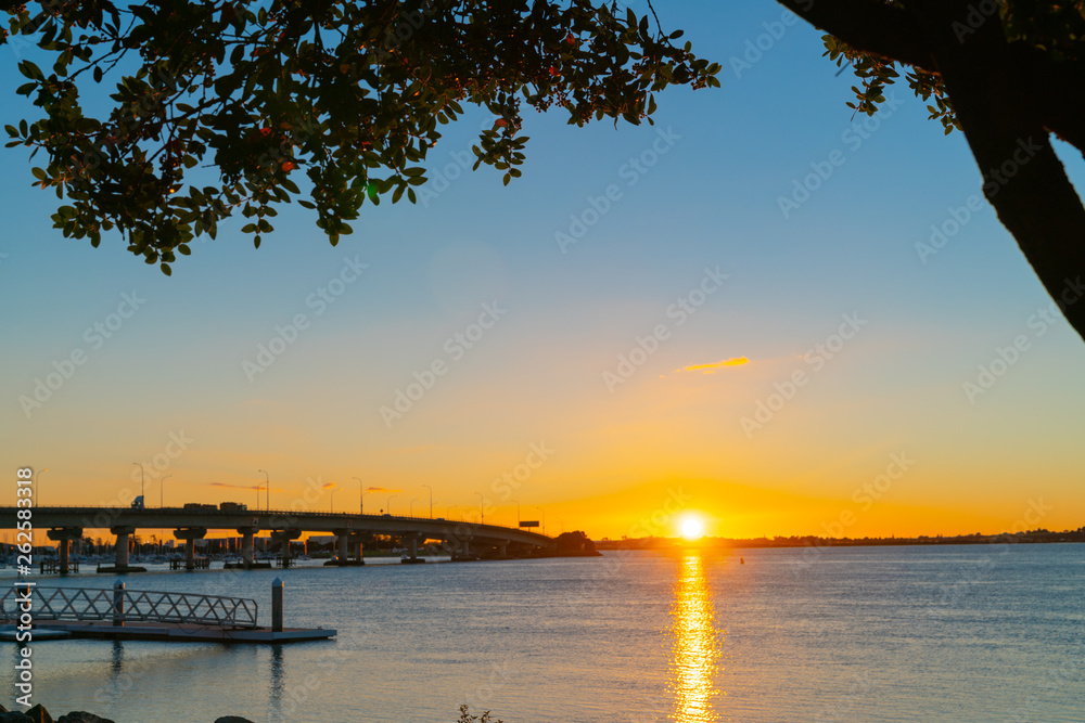 Sunrise  glows across harbor