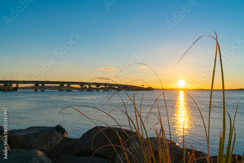 Sunrise glows across harbor