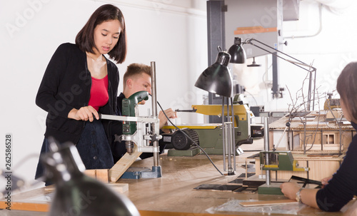 Students practicing architectural modeling in workshop