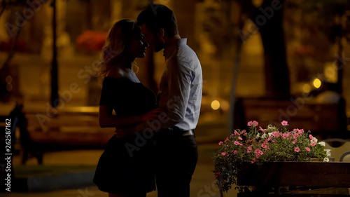Photos Couple of beloved going to kiss, romantic date in park, evening time, love