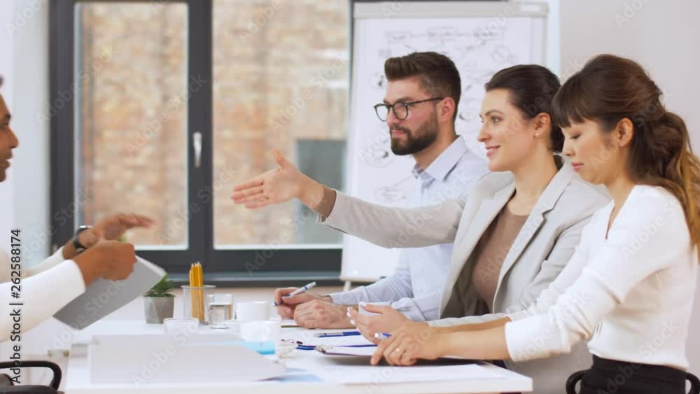 job, hiring and employment concept - international team of recruiters having interview with indian male employee at office job, hiring and employment concept - international team of recruiters having interview with indian male employee at office