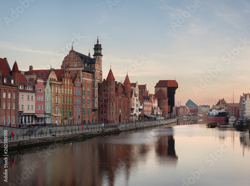 Old town of Gdansk in the early morning: an embankment and famous crane Zurav. High resolution panorama.