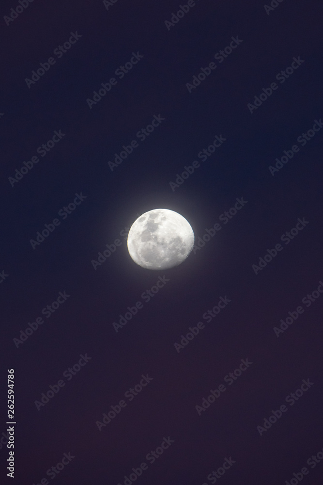 Moon during blue hour with misty night sky seen from southern hemisphere Moon during blue hour with misty night sky seen from southern hemisphere