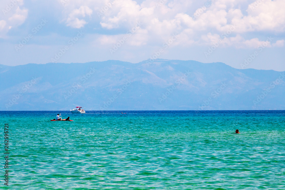 Paddleboarding, waterskiing and swimming at Ammolofoi Beach, Kavala Region, Northern Greece