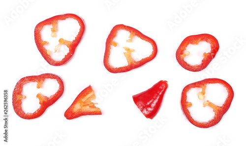 Fresh red pepper slices isolated on white background, top view