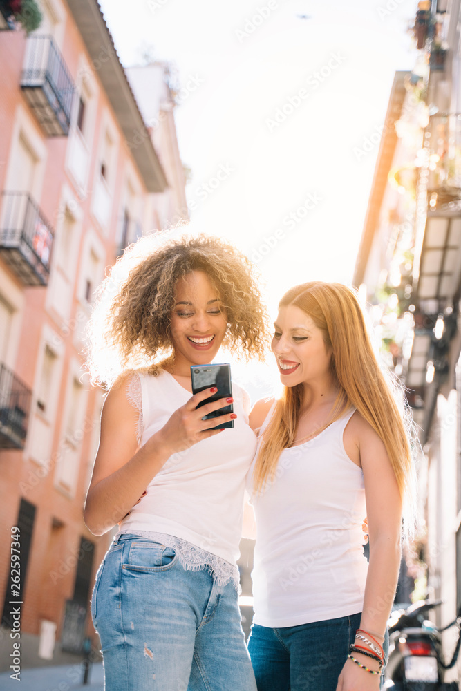 Beautiful women using a mobile in the Street. Beautiful women using a mobile in the Street.