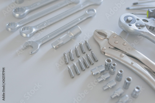 Background of a variety of tools for a construction worker on gray colour.