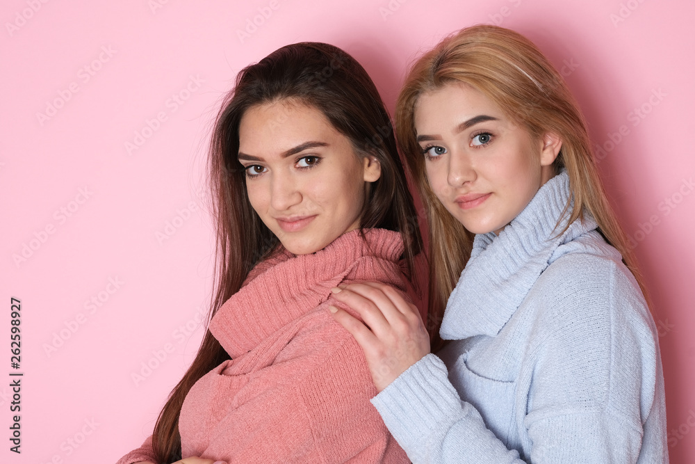 Two totally different looking sisters making funny faces at studio shoot. Two totally different looking sisters making funny faces at studio shoot.