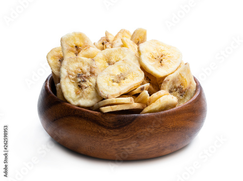 Homemade dehydrated banana chips isolated on white