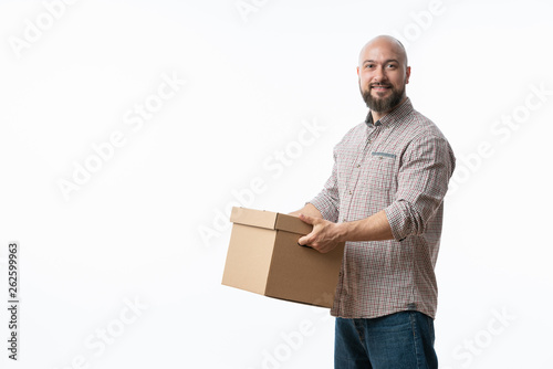 Portrait of a handsome young man holding card boxes, isolated on white