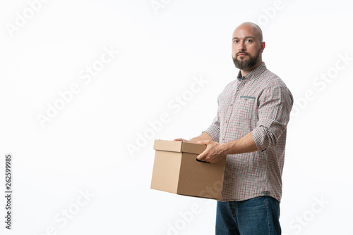 Portrait of a handsome young man holding card boxes, isolated on white