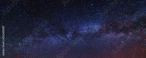 Fantastic starry sky with galaxy Milky way over mountainous masses of Ukrainian Carpathians