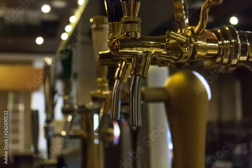 close-up of golden beer taps in a nightclub   bar   pub