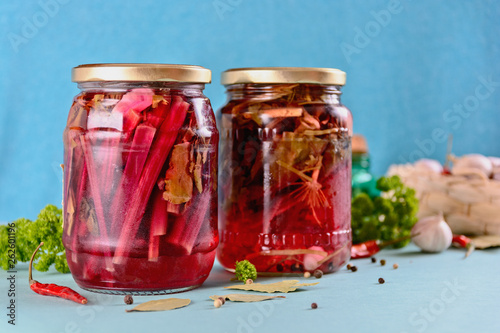 home canning, jars with pickled beet tops for harvesting for the winter