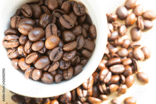 coffee beans in a white mug