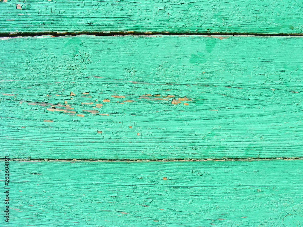 Rustic plank background of green and turquoise, weathered texture with copy space. Green empty wooden background.  Old dirty wall texture.