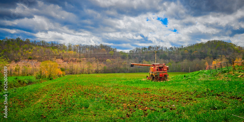 Old Abandoned Harvester in a Field