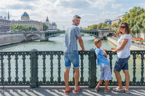Photography Happy family of three enjoying vacation in Paris, France