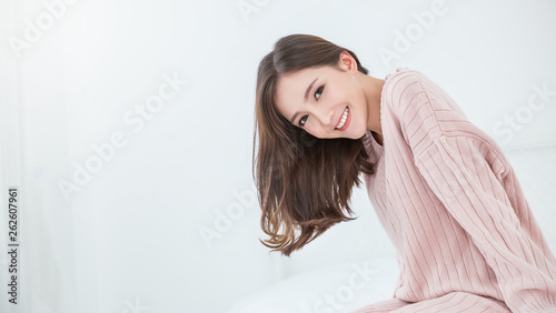 Portrait of young beautiful innocence asian woman relax in her bedroom. Asian girl face wear winter cloth. Beauty long hair treatment perfect clear skin japanese makeup lifestyle concept