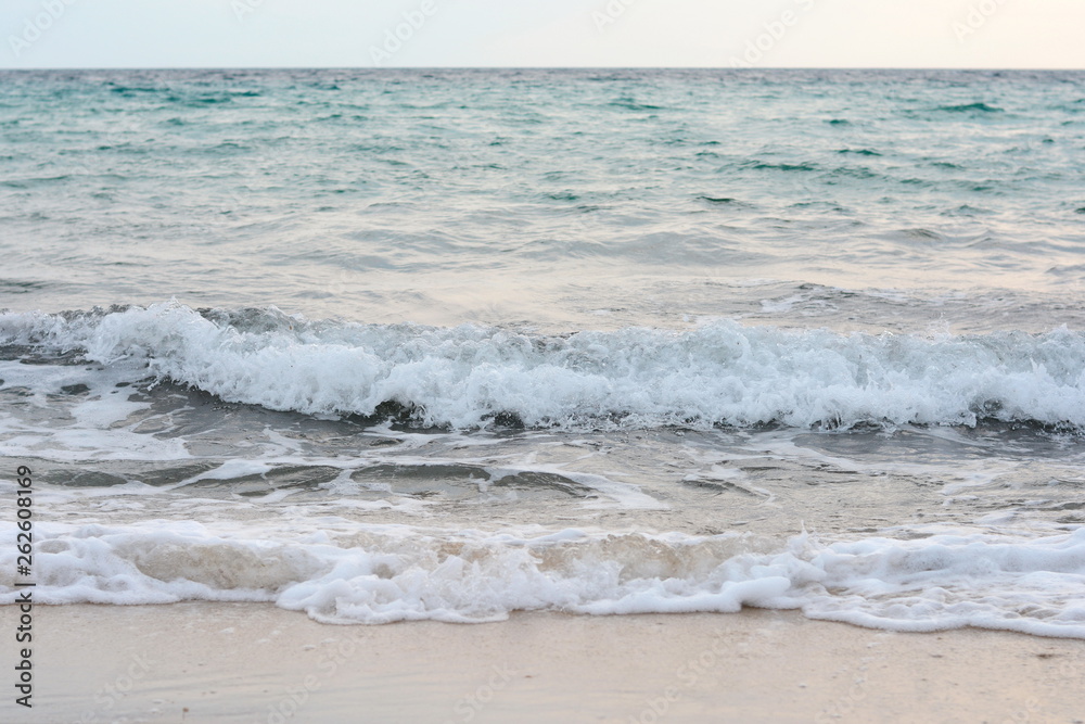 Beautiful soft waves of Blue Ocean with Sandy Beach Background close up. Sea sand wallpaper Beautiful soft waves of Blue Ocean with Sandy Beach Background close up. Sea sand wallpaper