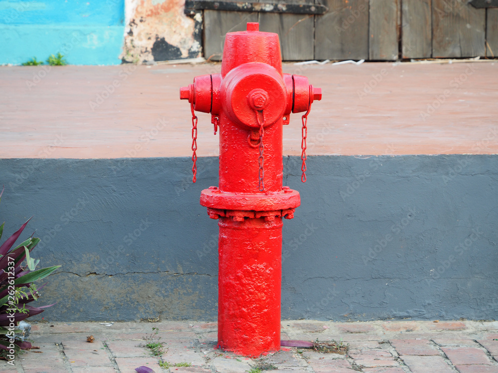 Bright red fire hydrant on the street. Bright red fire hydrant on the street.