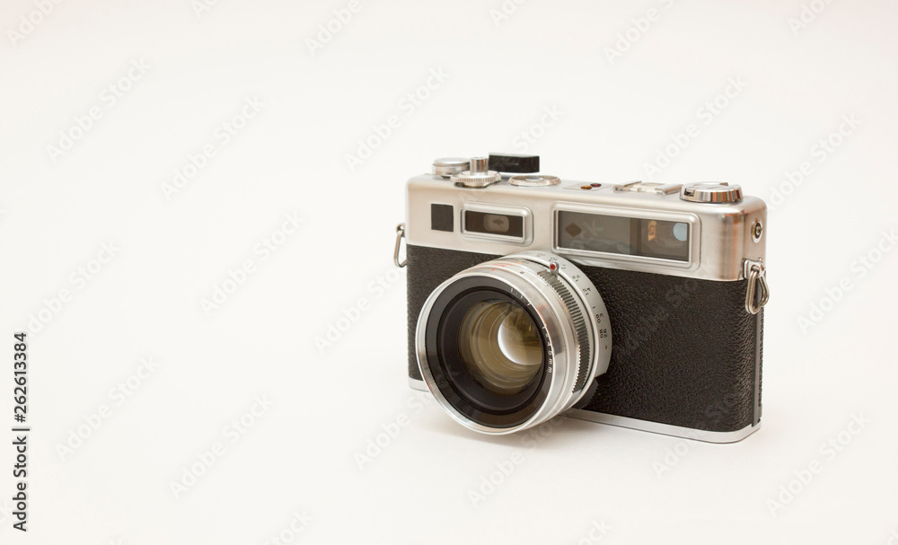 Old classic film photo camera on white background isolated with free space