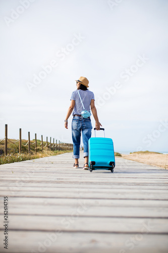 young woman traveling around the world