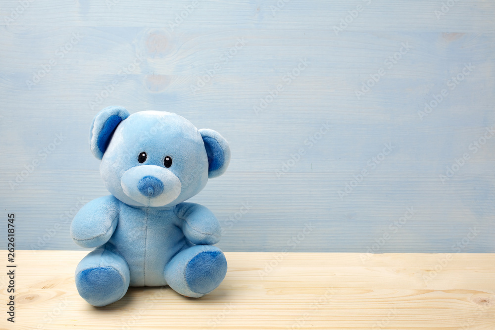 Teddy bear on a table have blue background Stock Photo | Adobe Stock