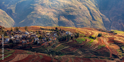 Dongchuan Red Soil, Colored Earth Terraces - Red Soil, Green Grass, Layered Terraces in Yunnan Province, China. Chinese Countryside, Agriculture, Exotic Unique Landscape. Farmland, Agriculture photo