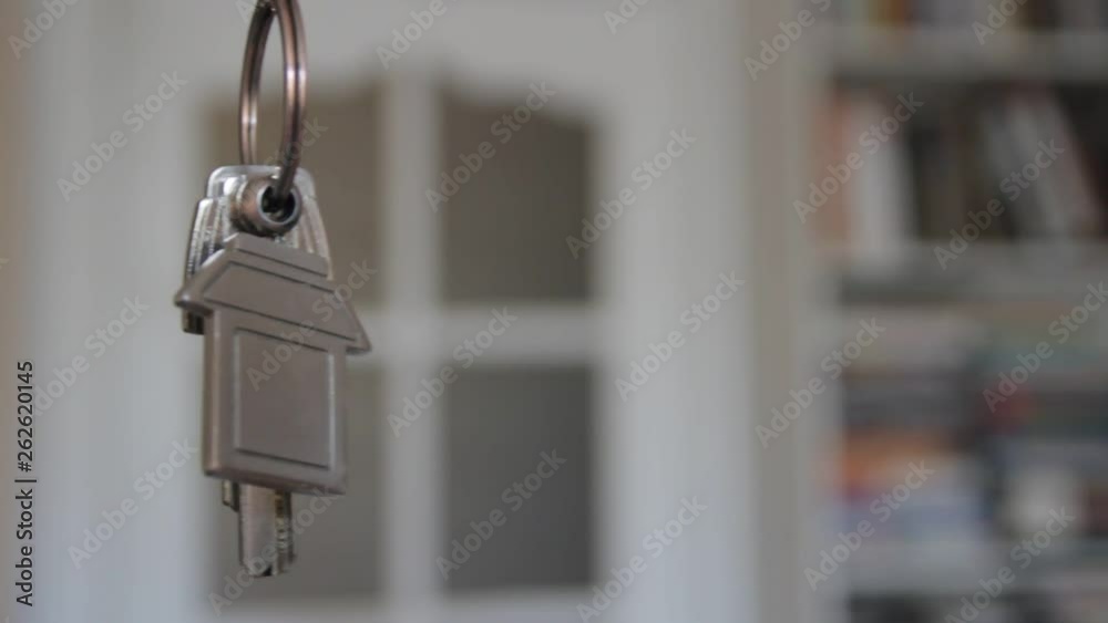 House keys with keychain rotate in the background House keys with keychain rotate in the background