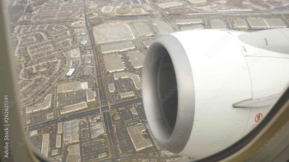 View of Highway 401, industrial landscape and suburbs of Mississauga, Ontario. Winter flight with view from inside commercial airliner. View of Highway 401, industrial landscape and suburbs of Mississauga, Ontario. Winter flight with view from inside commercial airliner.