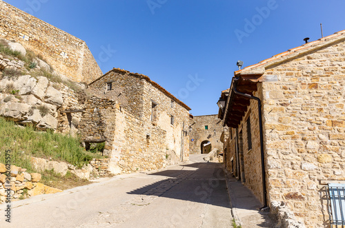 street with typical houses in Puertomingalvo village  province of Teruel  Aragon  Spain