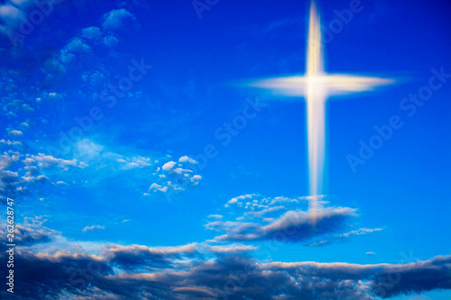 Heavenly Cross . Religion symbol shape .  Dramatic nature background  . Glowing cross in sky . Happy Easter. Light from sky . Religion background .  Paradise heaven . Light in sky .