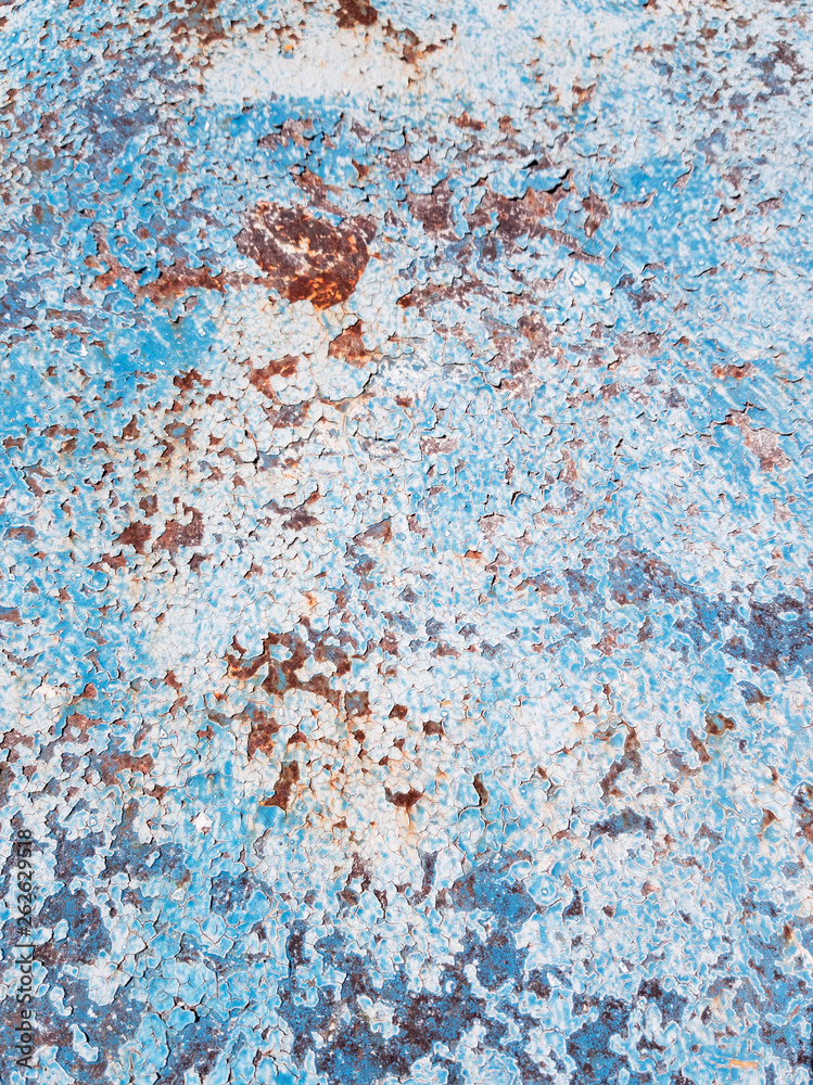 Textured background of blue peeling paint and rust Textured background of blue peeling paint and rust