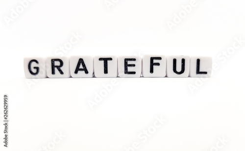 grateful word built with white cubes and black letters on white background